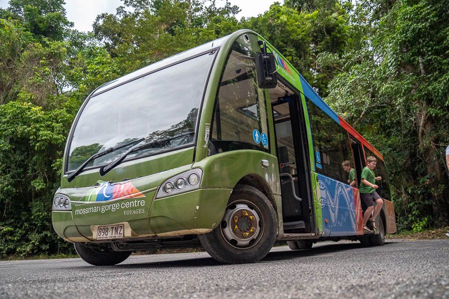 passenger shuttle bus parked near the rainforest in Mossman Gorge