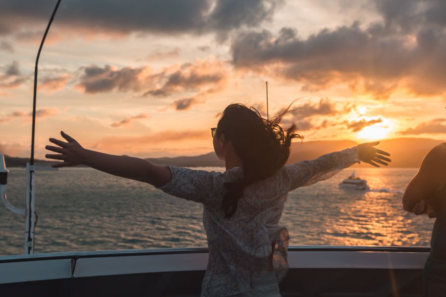 girl on boat at sunset