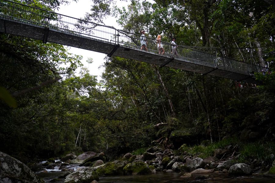 girls walking on bridge