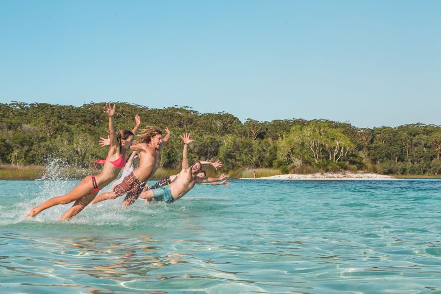 people jumping in water