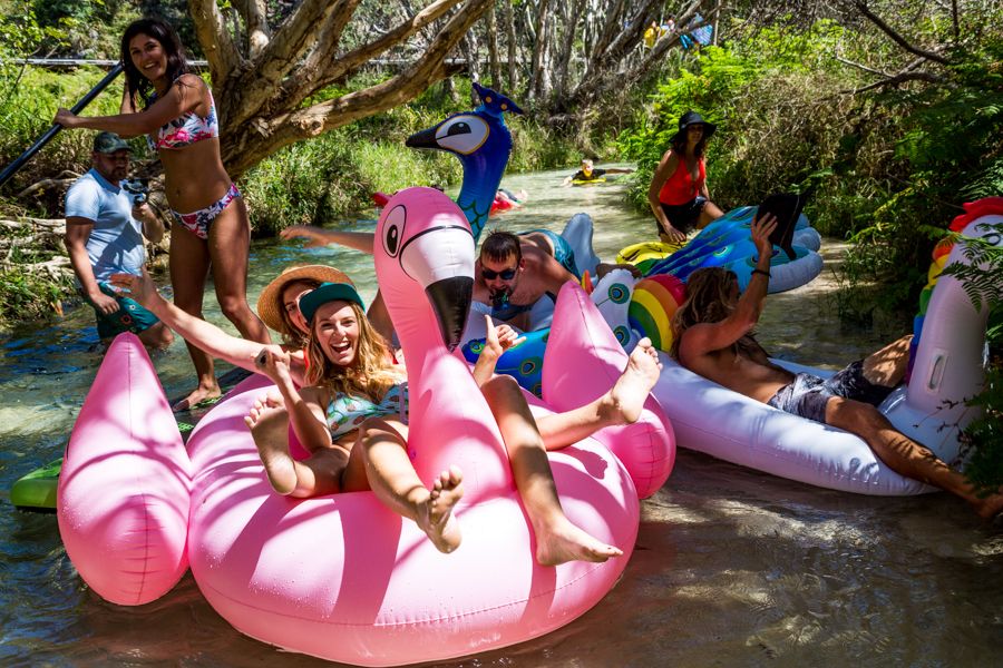 people on floats in river