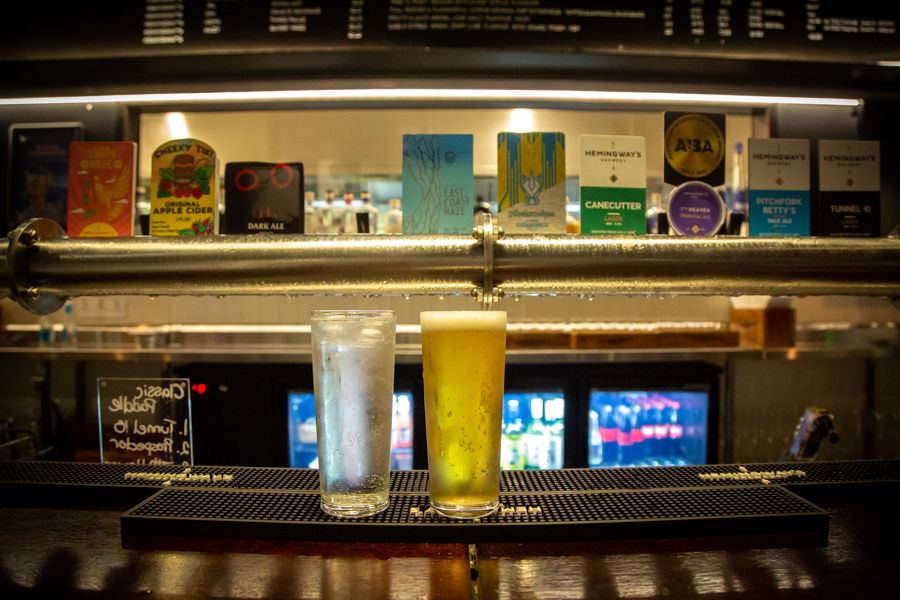 drinks sitting on the counter of a bar in australia