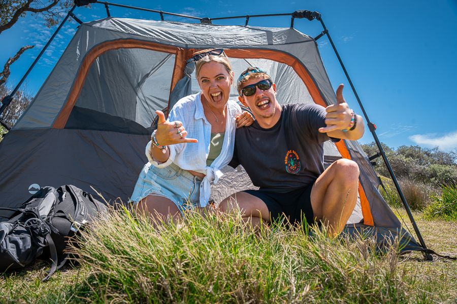 backpacker couple in front of a tent in the kgari wilderness
