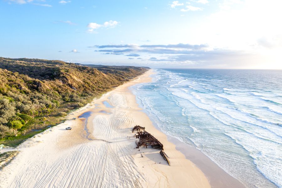 aerial view of shipwreck on beach