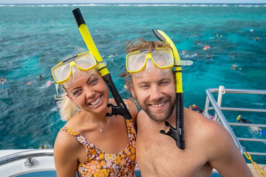 Couple smiling with snorkelling gear on