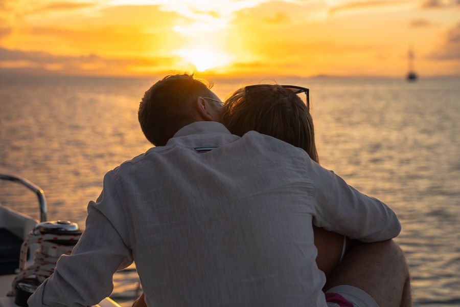 A couple on a sunset sail in Cairns