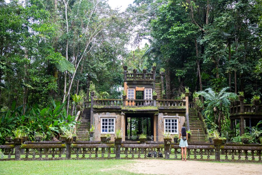 girl standing outside Paronella Park Castle