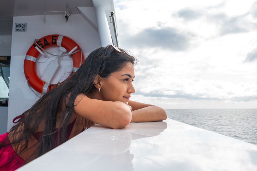girl admiring the great barrier reef on a boat tour