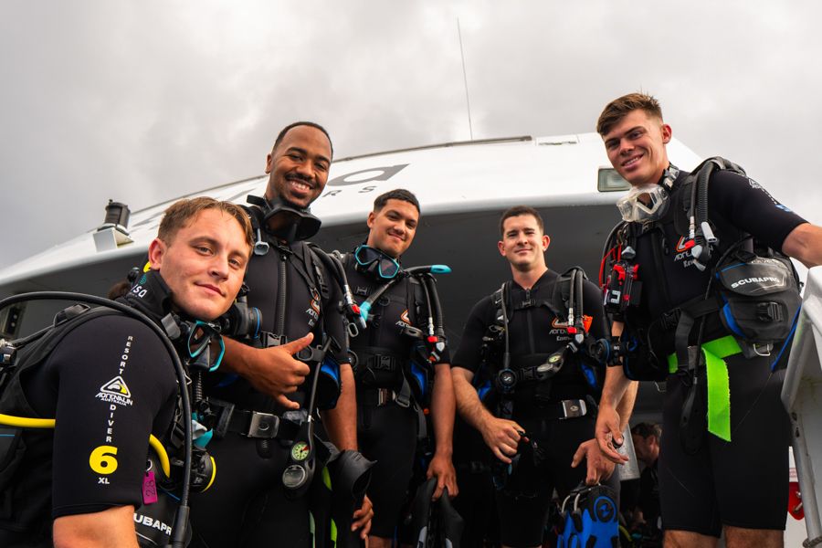 scuba divers on a liveaboard great barrier reef