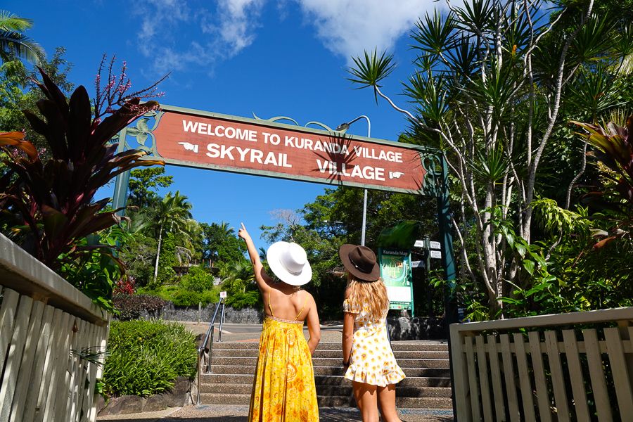 girls looking at the kuranda skyrail sign