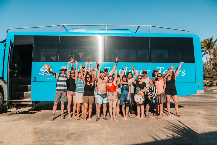 group in front of tour bus