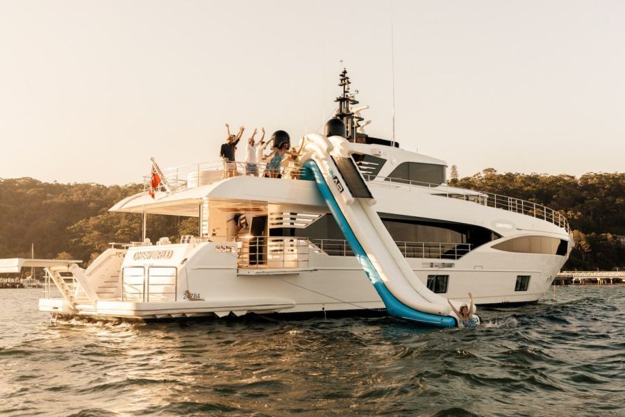 people enjoying One World Superyacht on the water