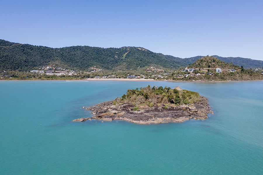 island and blue water at Cannonvale Beach