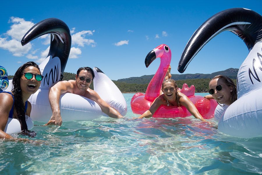 A group of people on inflatable toys in the ocean