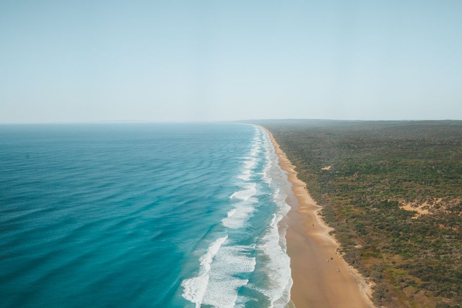 Pacific Ocean next to the sandy K'gari coastline