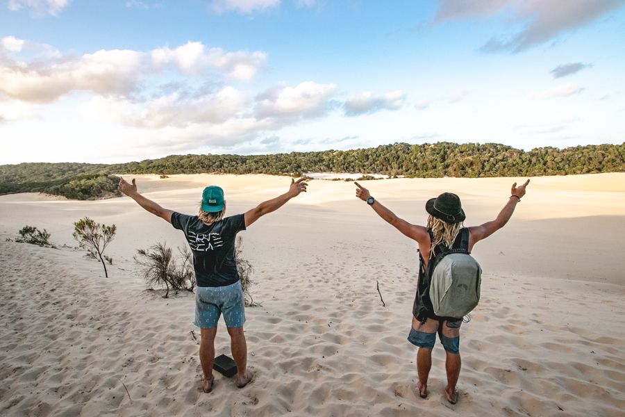 people posing on sand dunes at lake wabby k'gari