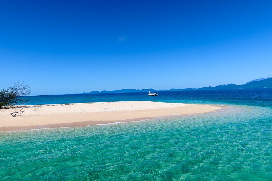 sandbar surrounded by turquoise waters near cairns