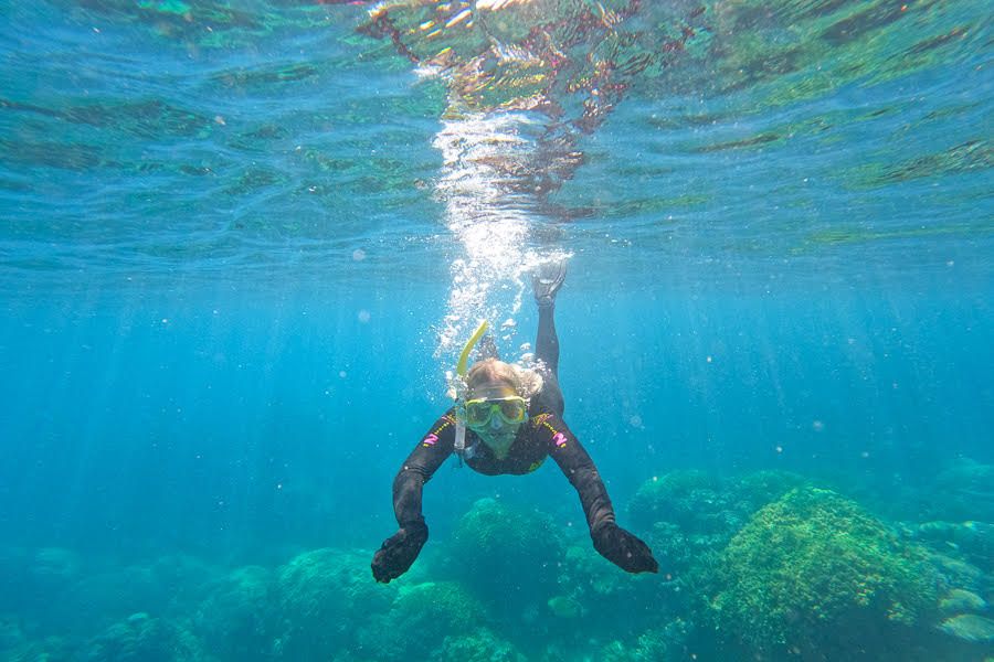 Diver swimming to ocean floor