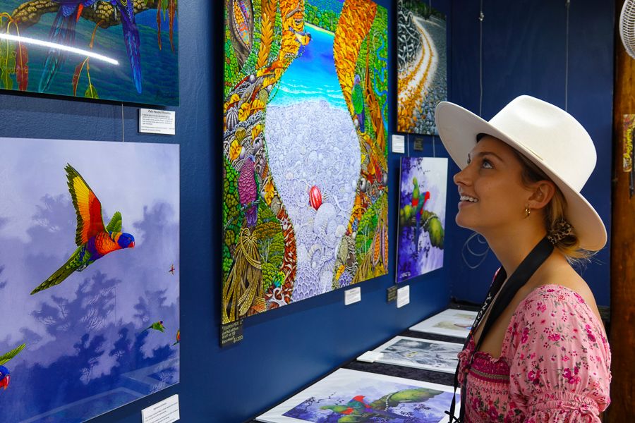 girl checking out local art at a local gallery in Australia