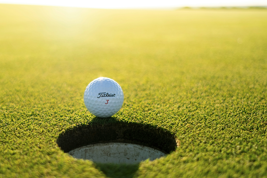 Hamilton Island Golf a close up of a golf ball on the green on a golf course