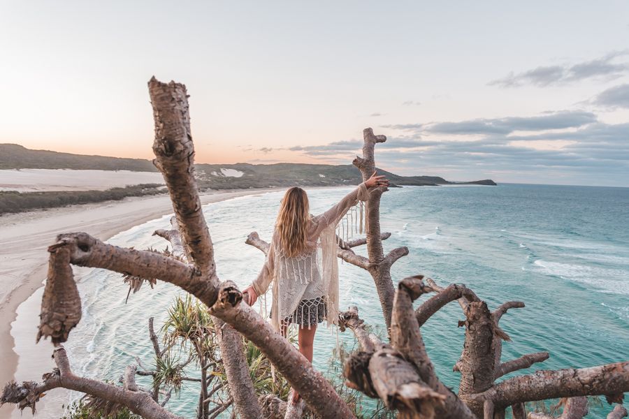 girl posing with a tree at Indian Head Lookout on K'gari