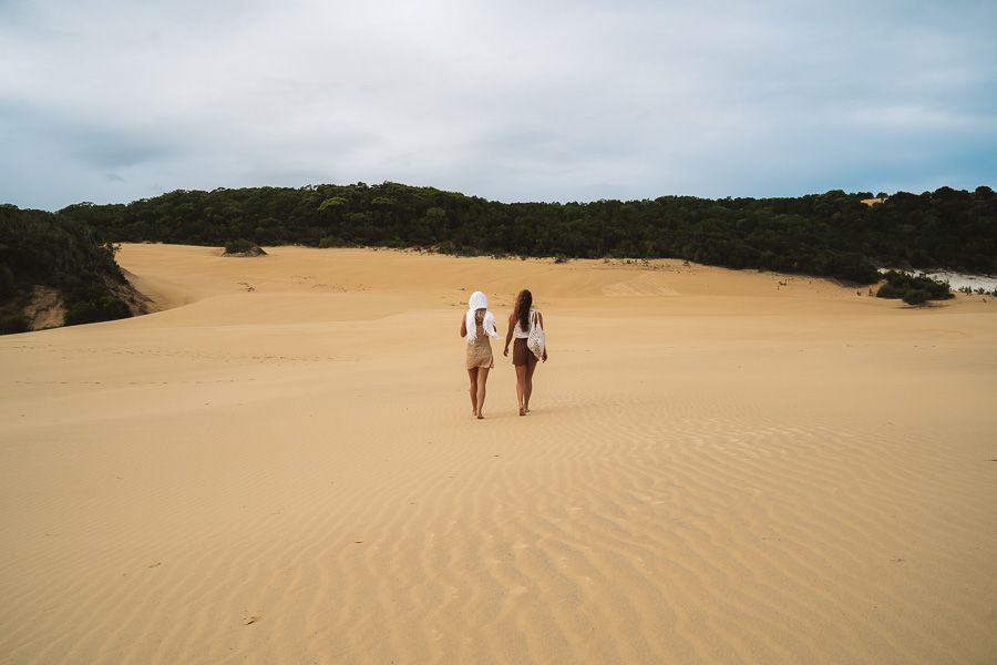 two girls walking along the sand dunes near Lake Wabby