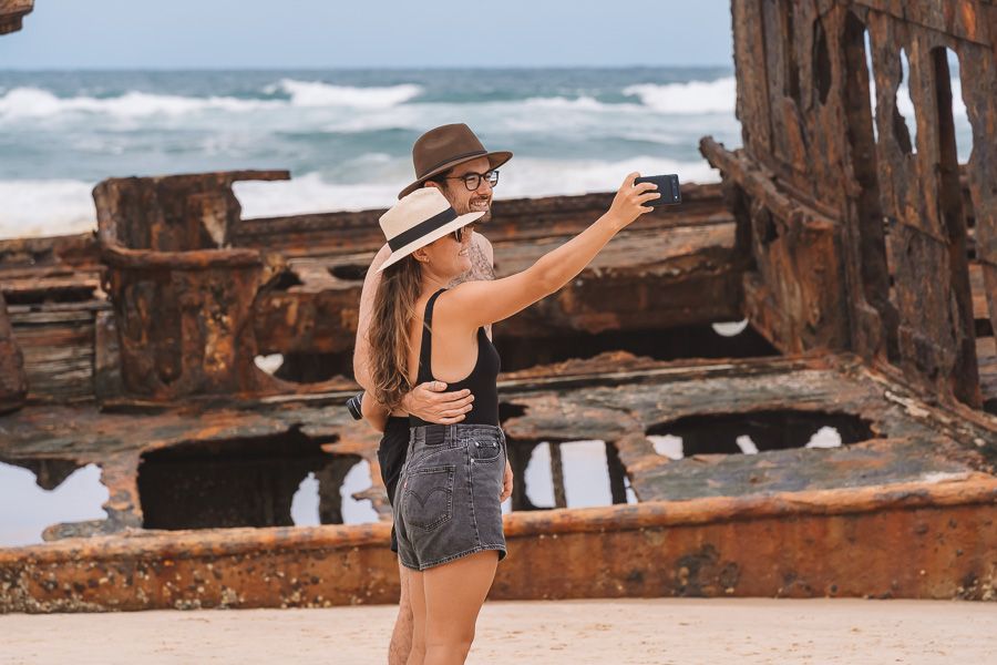 couple taking a selfie at the Maheno Shipwreck