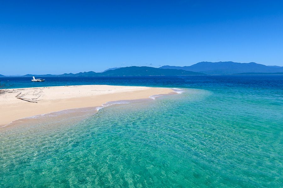 bright blue water and golden sand in the frankland islands