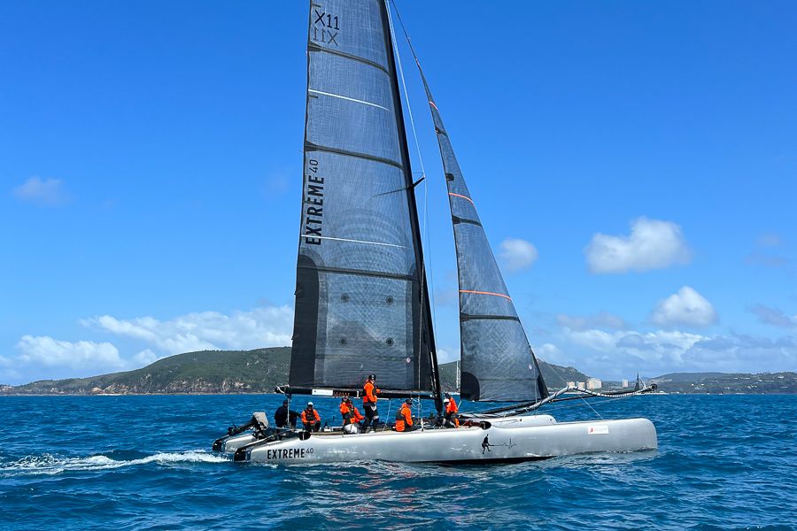 A sailing yacht with crew on board in the ocean