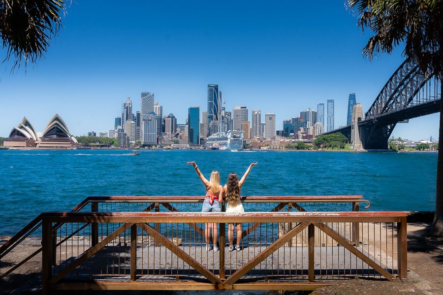 girls posing in front of sydney harbour australia