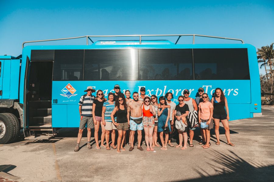 tour group in front of K'gari Explorer Tours Bus