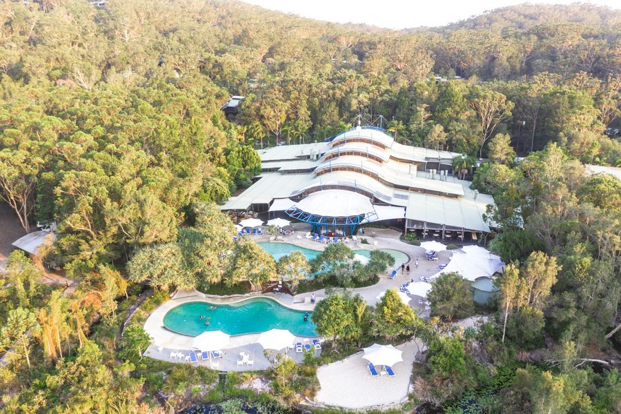 aerial view of Kingfisher Bay Resort pool and buildings on K'gari