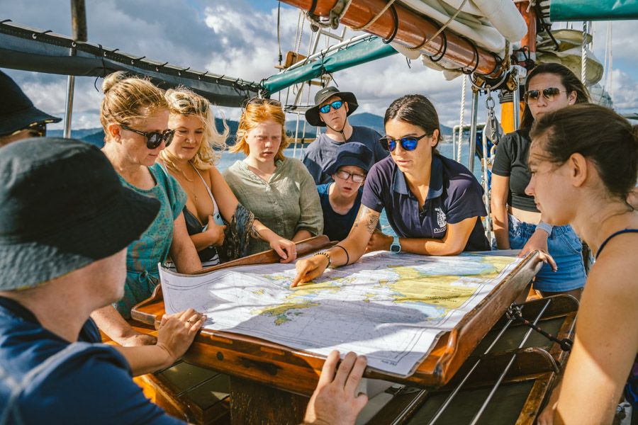 group learning about islands on a boat