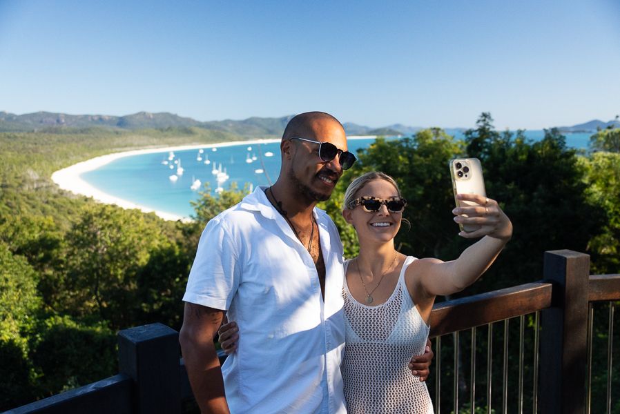 A couple at a Whitsunday lookout