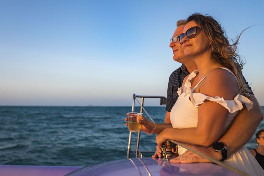 A couple at sunset with champagne