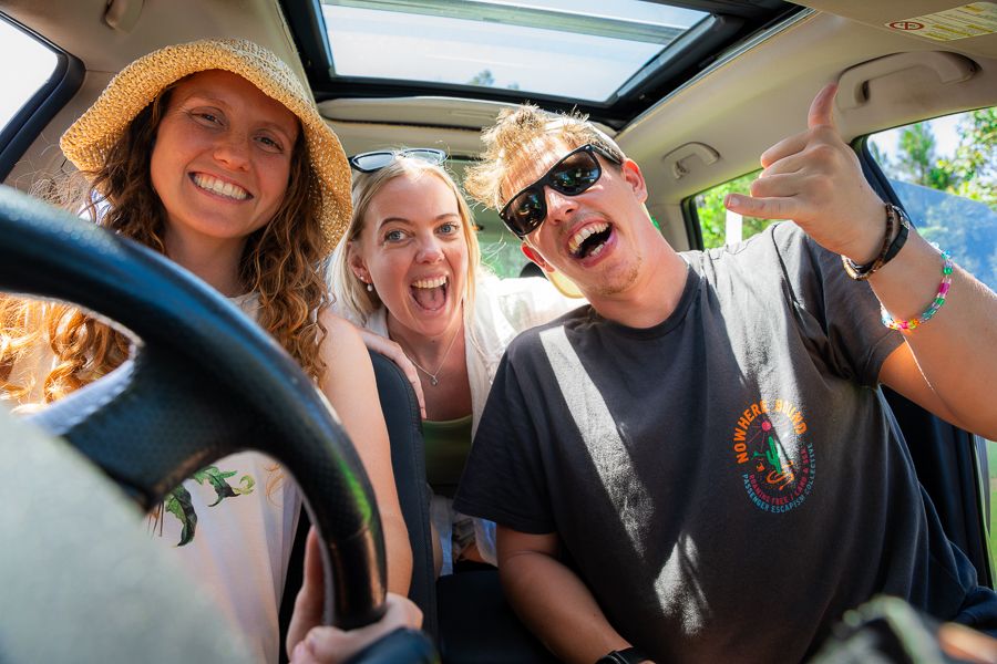 Rental Car Australia people smiling in a rental car in australia