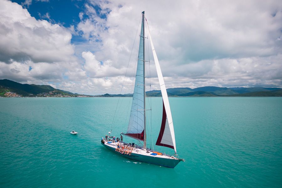 A drone shot of a boat at sea sailing