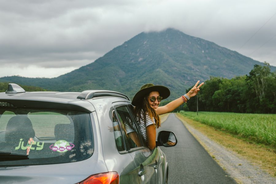 Cairns Rental Car girl posing from a rental car near cairns australia