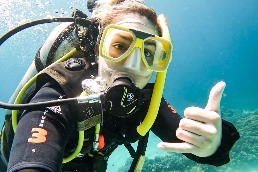 person taking a selfie while scuba diving