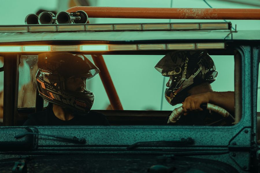 off road racers sitting in a vehicle