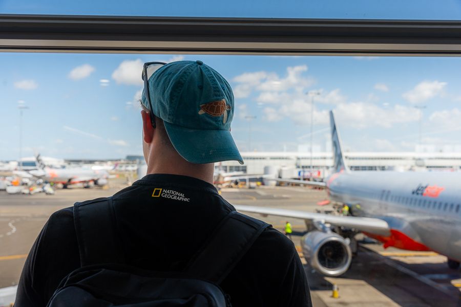 person looking out the window at australia airport