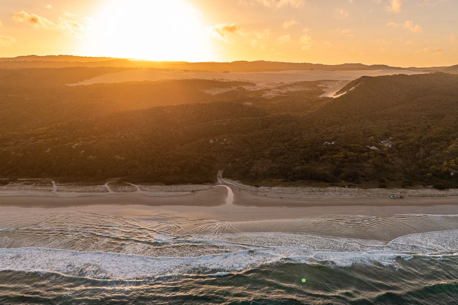 sunset over the dunes and coastline of kgari