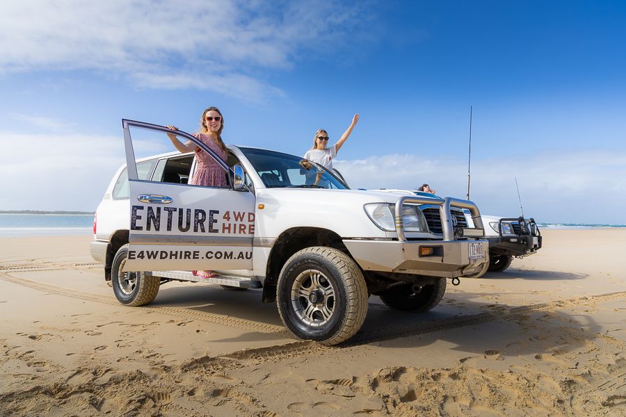 two people posing in an adventure 4wd rental on kgari