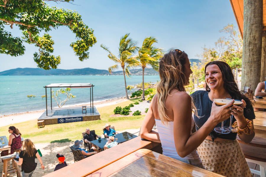 Two women enjoying cocktails in Northerlies