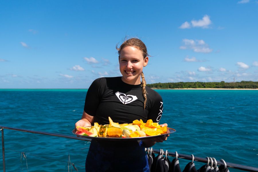 girl working on a boat serving food australia
