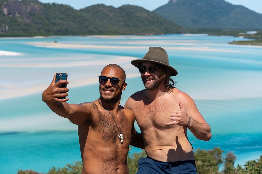 two guys taking a phone selfie at hill inlet lookout
