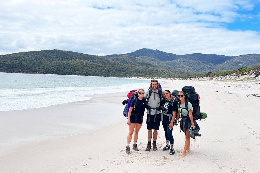 Group of hikers on a beach