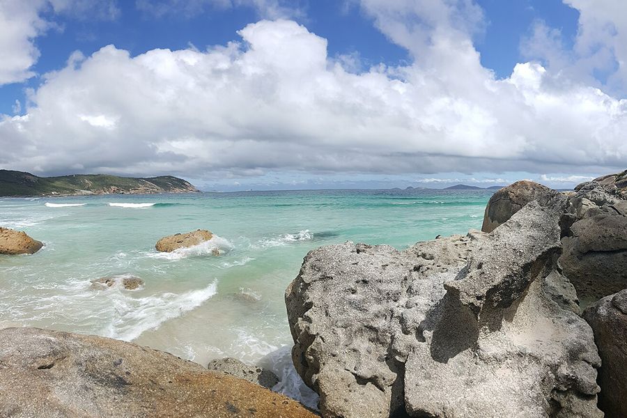 Beach view with rocks over crystal clear water
