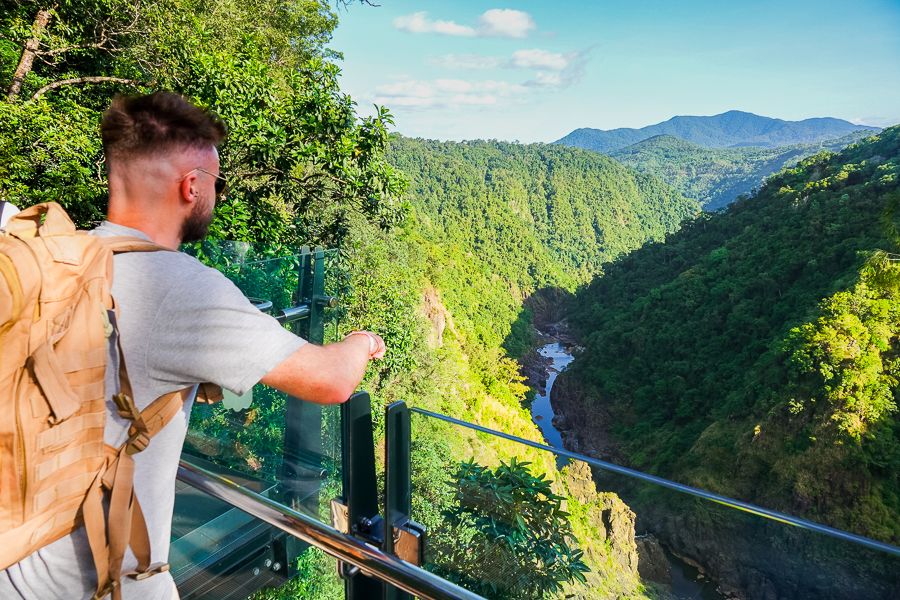 A man admiring Barron Falls in Cairns, Queensland