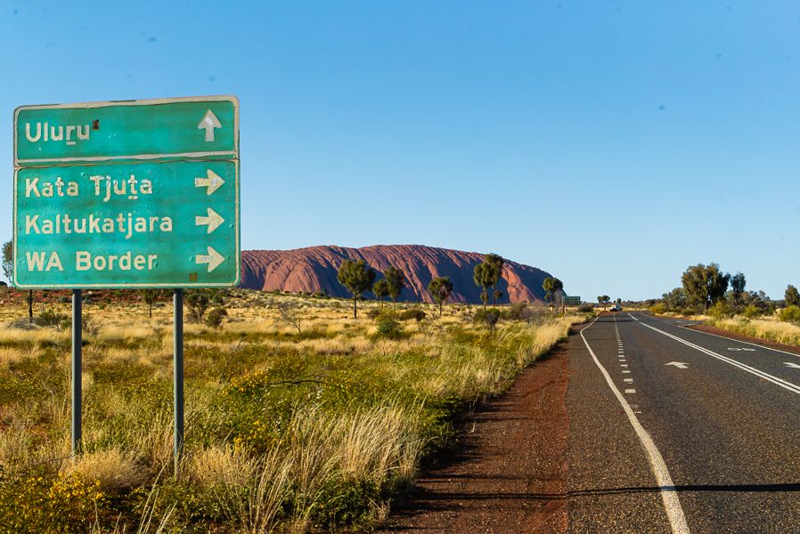 street signs around uluru in the red centre